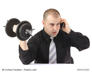man on phone at gym